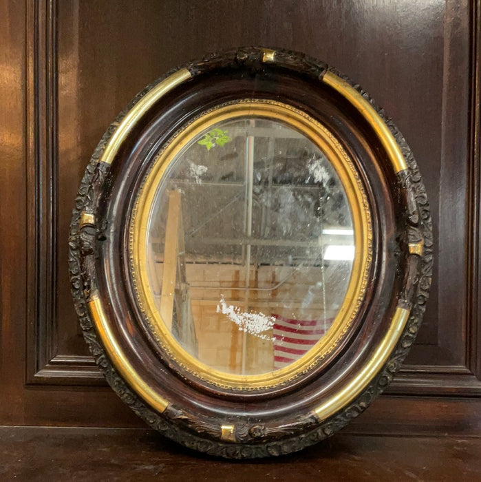 FAUX ROSEWOOD & GILT OVAL MIRROR