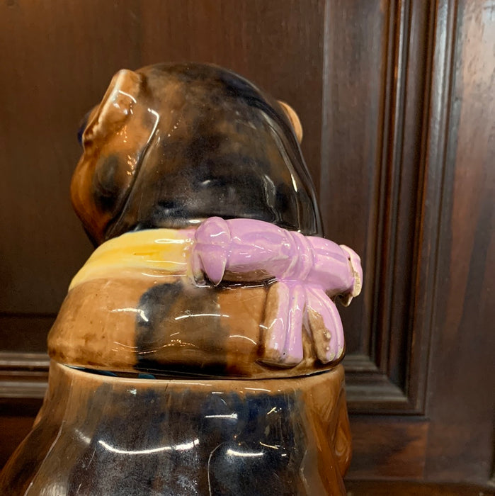 STAFFORDSHIRE BULLDOG JAR WITH LILAC COLORED BOW ON THE BACK