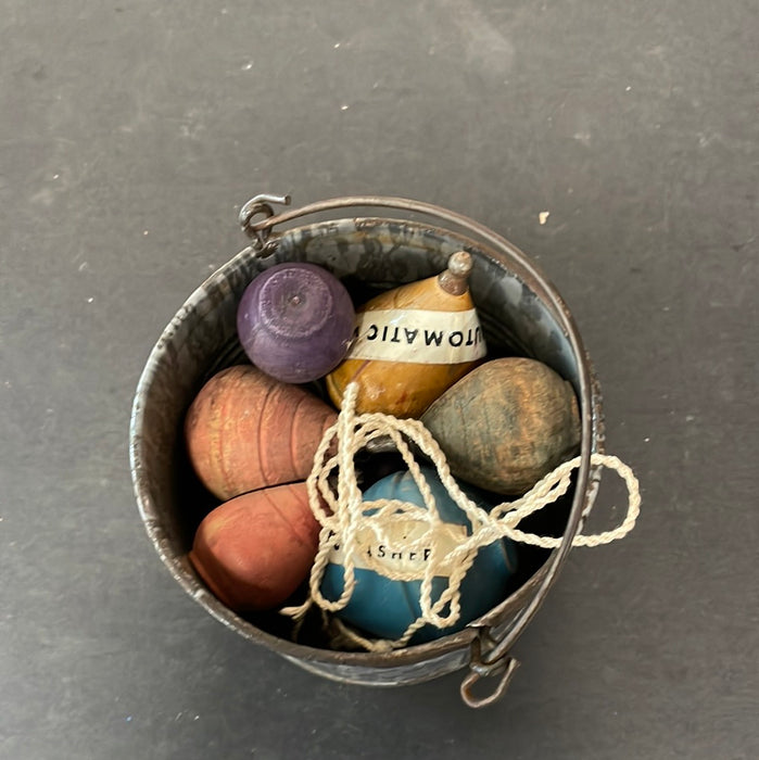 GRAY ENAMEL BUCKET WITH OLD TOPS