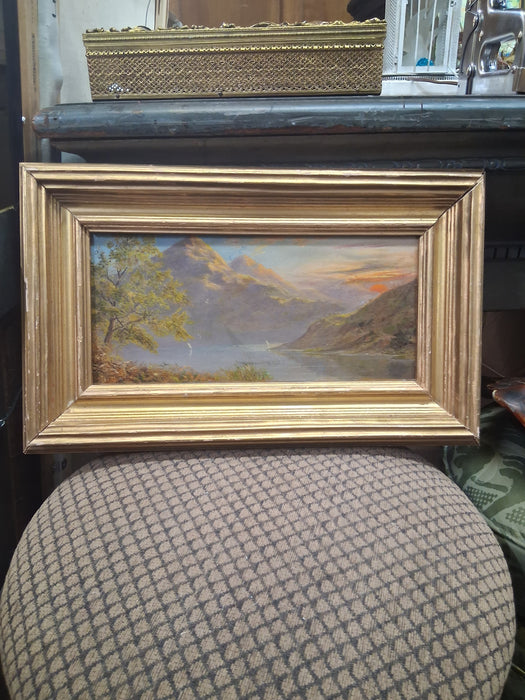 SMALL FRAMED OIL PAINTING WITH RED SUN