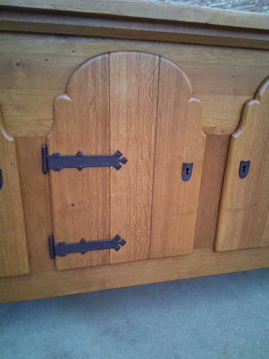 LARGE RUSTIC OAK SIDEBOARD WITH IRON HINGES AND ARCHED DOORS