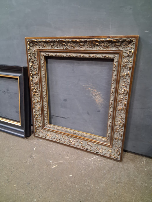 ORNATE BRONZE AND GOLD WOOD FRAME