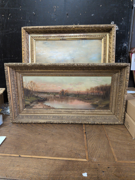 GOLD FRAMED OIL PAINTING OF TREES AROUND LAKE