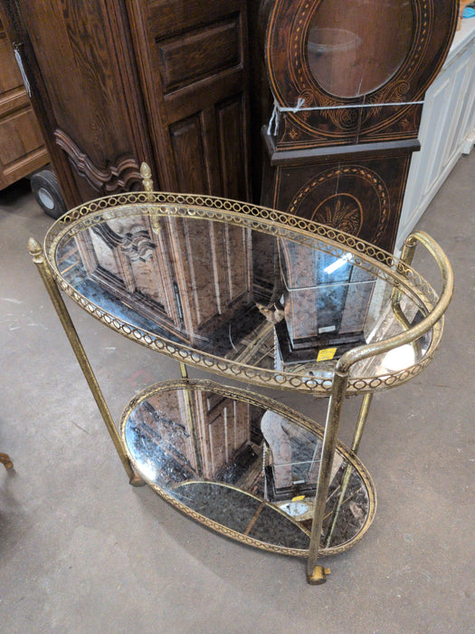 HOLLYWOOD REGENCY OVAL BRASS BAR CART WITH MIRRORED TOPS