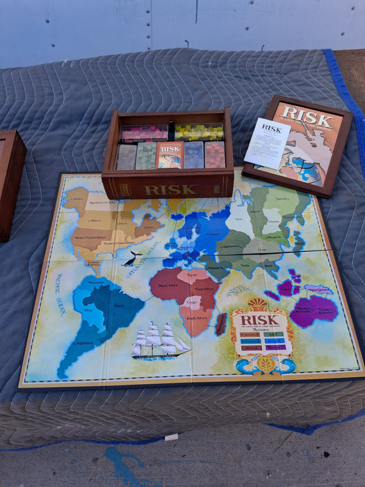 SET OF 4 DELUXE GAMES IN WOOD BOOK BOXES (MONOPOLY, SCRABBLE, RISK, AND CLUE)