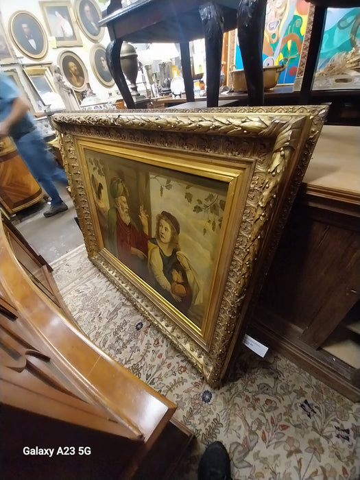 ORNATE GILT FRAMED OIL PAINITNG WITH BEARDED SAGE ADMONISHING MOTHER AND CHILD