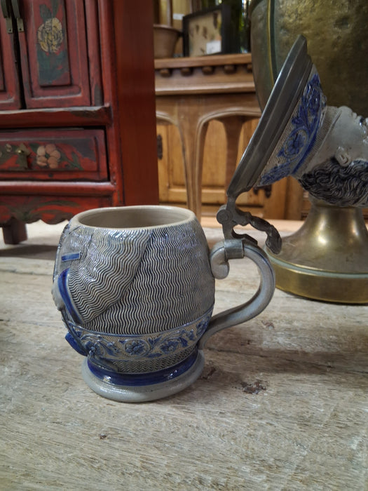 SMALL GREY AND BLUE GERMAN STEIN WITH FIGURAL LID