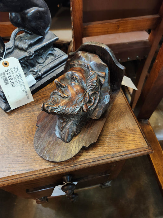 CARVED ELM SHELF WITH MAN'S HEAD