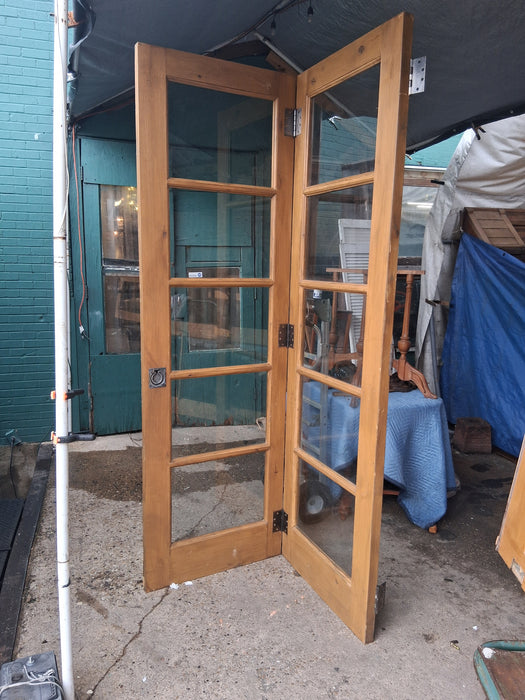 PAIR OF PINE DOORS WITH MULLIONED GLASS PANES