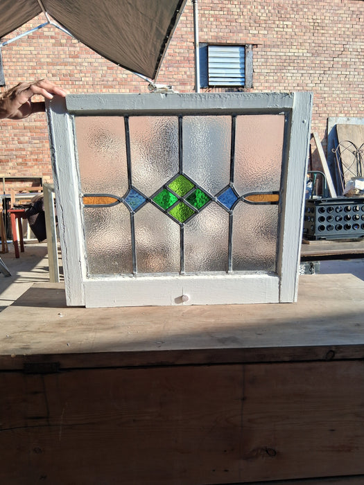 WHITE FRAMED MEDIUM GEOMETRIC ENGLISH STAINED GLASS WINDOW