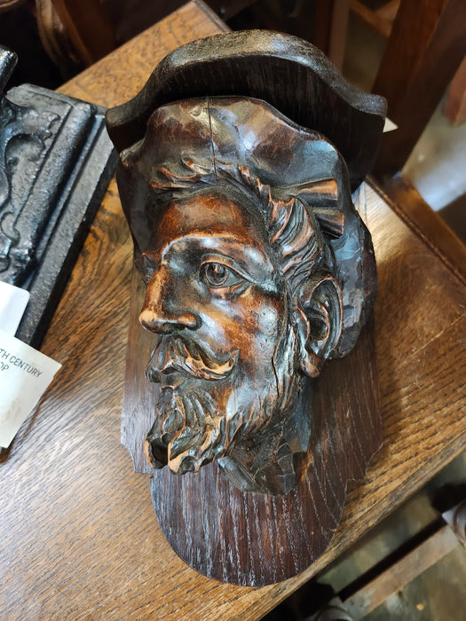 CARVED ELM SHELF WITH MAN'S HEAD