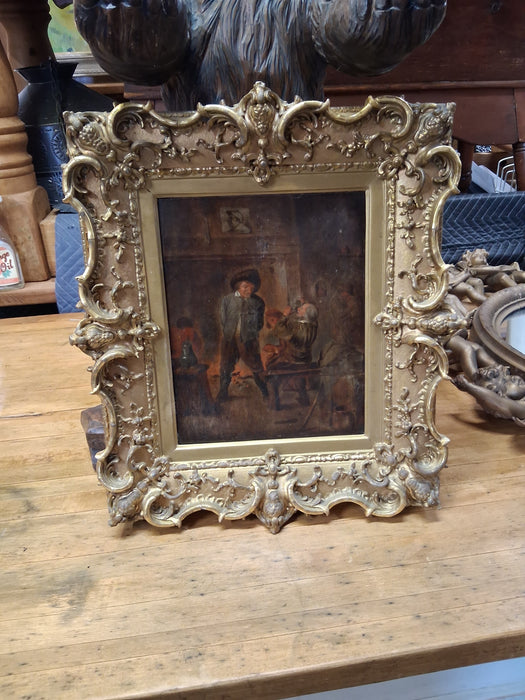 ORNATELY FRAMED OIL PAINTING OF MEN IN A TAVERN