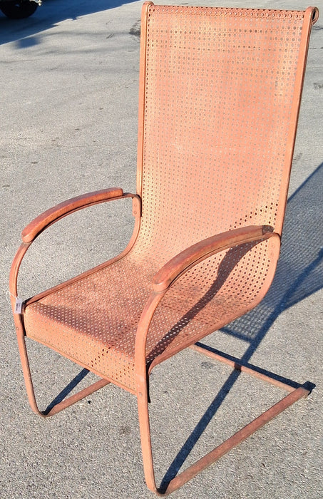 RUST COLORED ROCKER CHAIR WITH CANE MESH SEAT