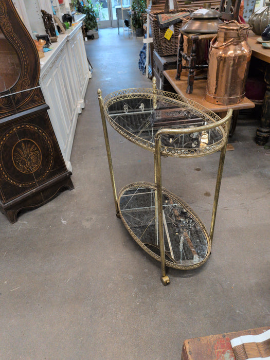 HOLLYWOOD REGENCY OVAL BRASS BAR CART WITH MIRRORED TOPS
