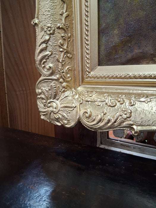 GILT FRAMED OIL PAINTING OF CHICKENS ALONG THE RIVER BANK AN A MAN IN A BOAT