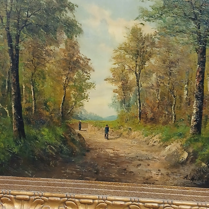 LARGE GILT FRAMED LANDSCAPE OIL PAINTING ON CANVAS OF 2 PEOPLE ON A FOREST PATH