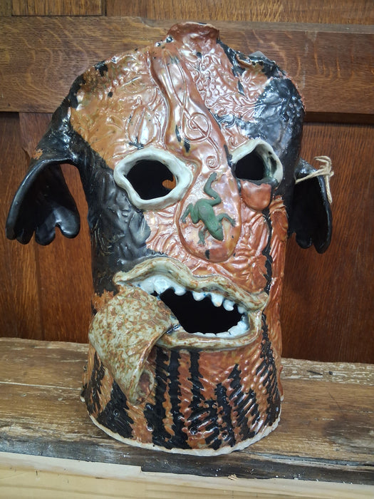 BROWN POTTERY HEAD WITH PINK TONGUE AND BLUE EYES BY TERRI WILDER