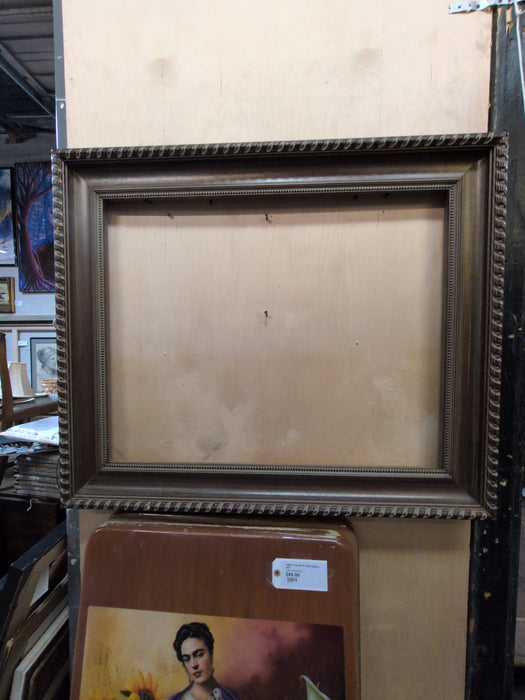 LARGE BROWN FRAME WITH BEADING