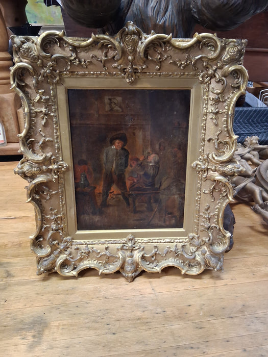 ORNATELY FRAMED OIL PAINTING OF MEN IN A TAVERN