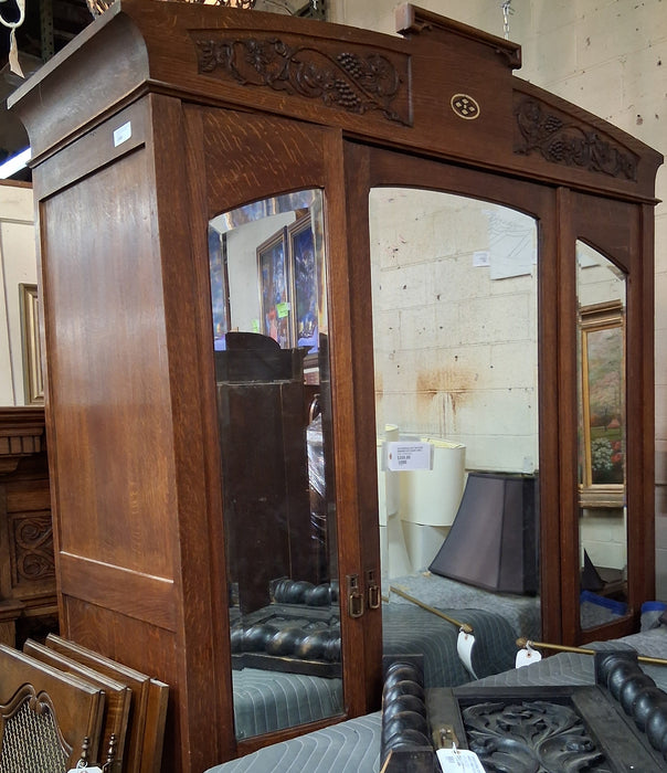 ART NOUVEAU OAK TWO DOOR ARMOIRE WITH GRAPE VINES