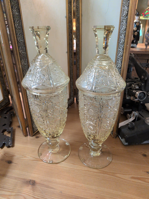 PAIR OF TALL LIDDED YELLOW CRYSTAL FOOTED JARS
