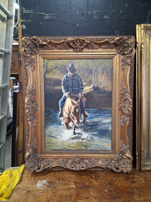FRAMED OIL PAINTING OF A HORSE RIDER CROSSING A STREAM - SIGNED SHERRY HERRINGTON 1995