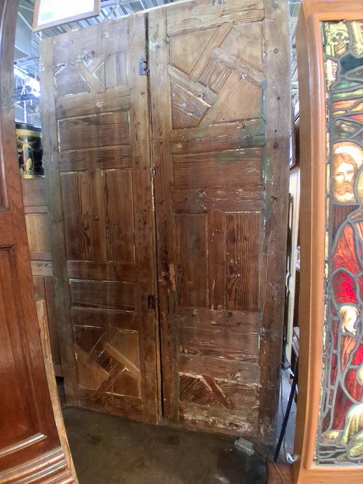 PAIR OF TALL RAW PINE PANELED DIAGONAL DOOR