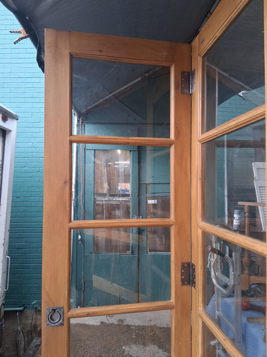 PAIR OF PINE DOORS WITH MULLIONED GLASS PANES