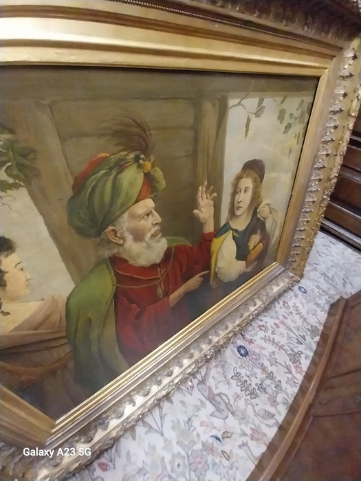 ORNATE GILT FRAMED OIL PAINITNG WITH BEARDED SAGE ADMONISHING MOTHER AND CHILD