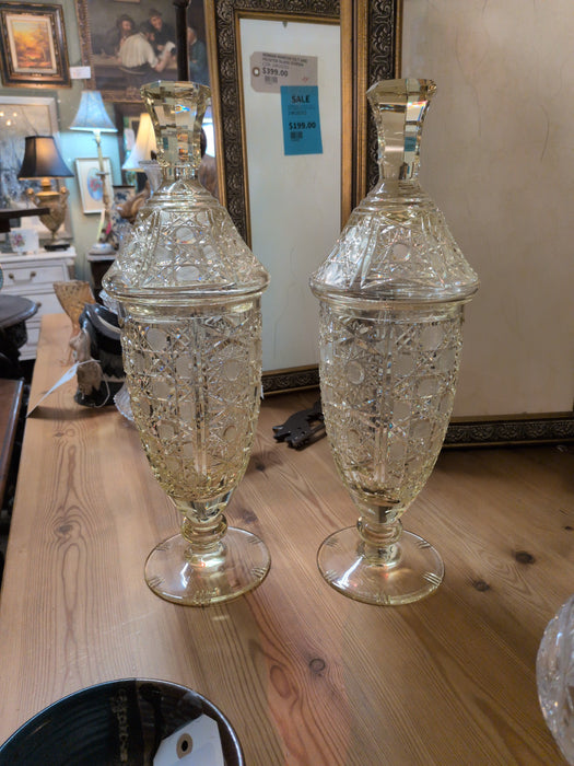 PAIR OF TALL LIDDED YELLOW CRYSTAL FOOTED JARS
