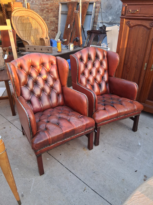 PAIR OF RUST CHESTERFIELD CHAIRS