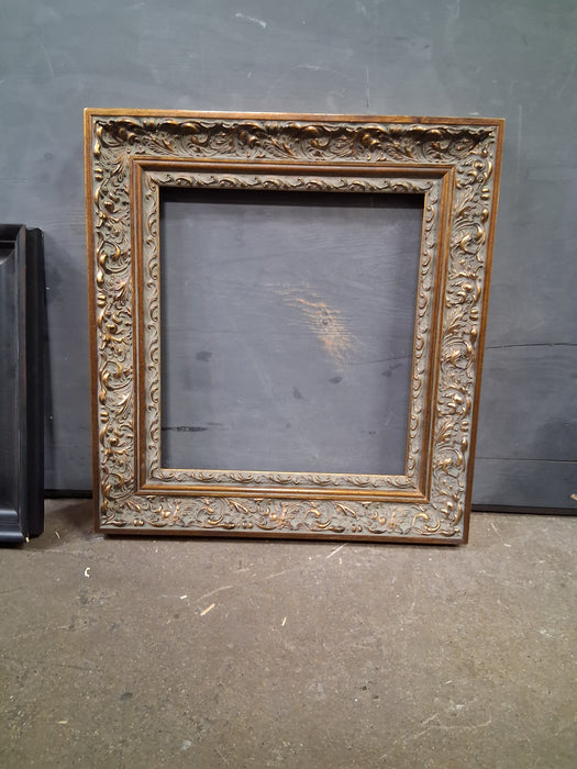 ORNATE BRONZE AND GOLD WOOD FRAME