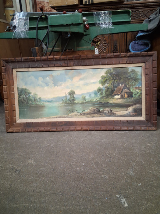 LONG FRAMED LANDSCAPE OF A HUT ON A LAKE