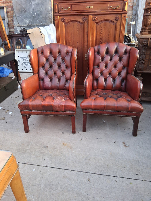 PAIR OF RUST CHESTERFIELD CHAIRS