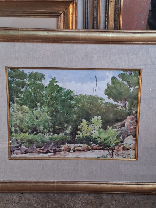 FRAMED WATERCOLOR OF TREES AND A STREAM