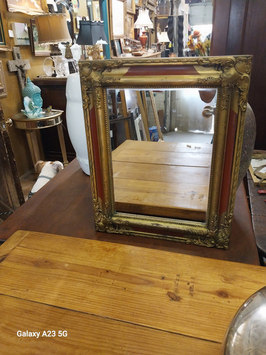GOLD AND RED FRAMED MIRROR