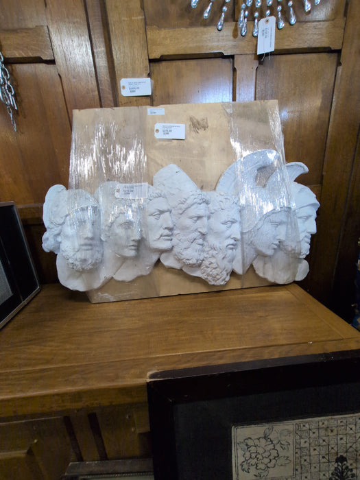 WHITE PLASTER RELIEF WITH SOILDER HEADS