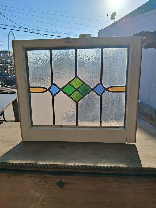 WHITE FRAMED MEDIUM GEOMETRIC ENGLISH STAINED GLASS WINDOW