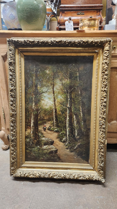 GOLD FRAMED VERTICAL OIL PAINTING OF LADY IN WOODS