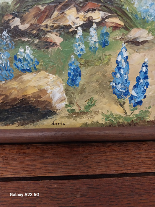 FRAMED OIL PAINTING OF A YUCCA AND BLUE BONNETS SIGNED DORIS