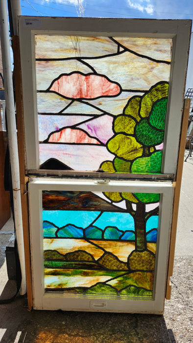 PAIR OF STAINED GLASS WINDOWS WITH ABSTRACT LANDSCAPE AND TREE