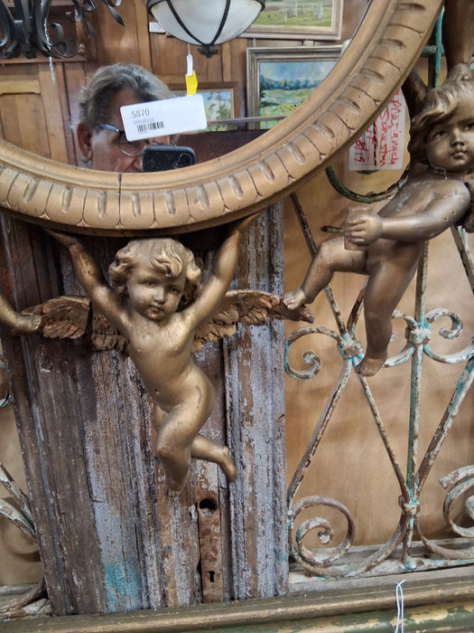 ROUND ITALIAN MIRROR SURROUNDED BY CARVED CHERUBS