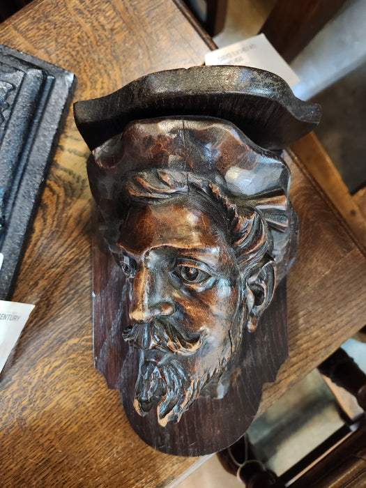 CARVED ELM SHELF WITH MAN'S HEAD