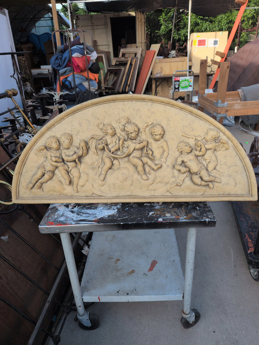 DECORATIVE ARCHED CHERUB RELIEF