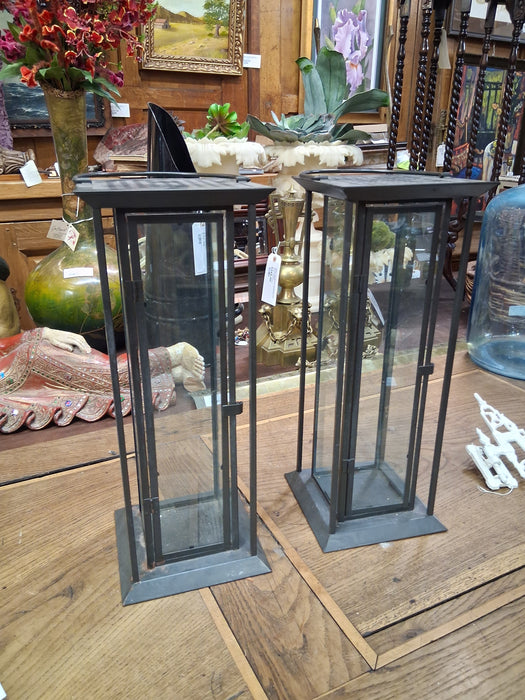 PAIR OF TALL BLACK IRON IN GLASS CANDLE HOLDERS