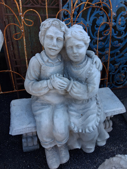 CONCRETE OLD PEOPLE ON A BENCH