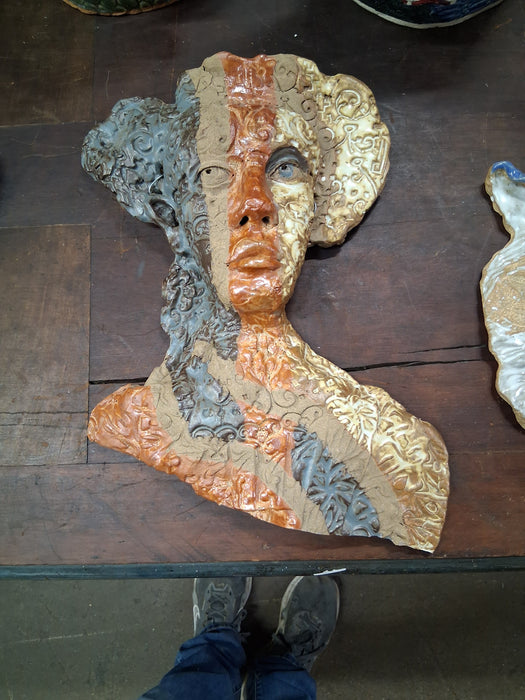BURNT ORANGE AND GREEN LADY POTTERY MASK BY TERRI WILDER