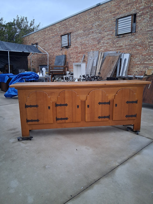 LARGE RUSTIC OAK SIDEBOARD WITH IRON HINGES AND ARCHED DOORS