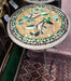 Decorative mosaic table with bird design on a market stall background
