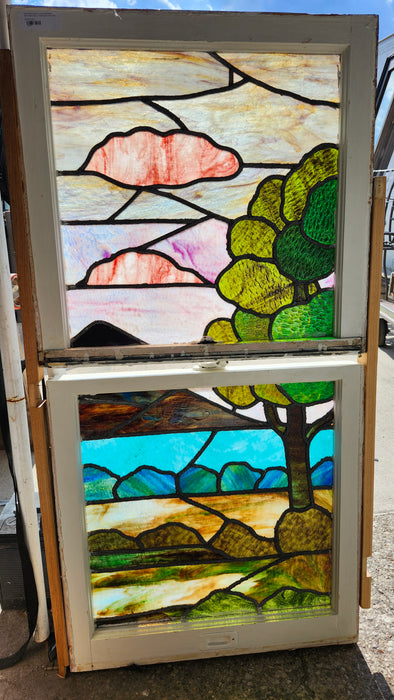 PAIR OF STAINED GLASS WINDOWS WITH ABSTRACT LANDSCAPE AND TREE